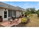 Charming outdoor patio with a table and chairs, great for enjoying the beautiful surroundings at 9607 Brassie Ct # 9607, New Port Richey, FL 34655