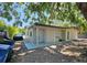 Exterior back view of the home features a covered porch at 10006 Memorial Hwy, Tampa, FL 33615