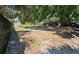Overgrown backyard space offers plenty of room for activities and landscaping at 10006 Memorial Hwy, Tampa, FL 33615