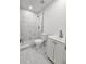 Modern bathroom with a glass shower, a toilet, and white vanity with modern fixture at 10006 Memorial Hwy, Tampa, FL 33615
