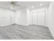 Spacious bedroom with neutral walls, vinyl floors, ceiling fan, and a closet for plenty of storage at 10006 Memorial Hwy, Tampa, FL 33615
