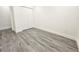 Bedroom featuring neutral walls, vinyl floors and a closet for storing items at 10006 Memorial Hwy, Tampa, FL 33615