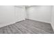 Well lit bedroom with neutral walls, vinyl floors and a closet for storing items at 10006 Memorial Hwy, Tampa, FL 33615