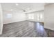 Bright and spacious living room featuring new floors, paint and updated windows at 10006 Memorial Hwy, Tampa, FL 33615