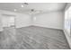 Spacious living room featuring new floors, recessed lighting and updated windows at 10006 Memorial Hwy, Tampa, FL 33615