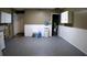Finished basement area with washer/dryer hookups, water heater, painted walls, and white trim at 101 S Maywood Ave, Clearwater, FL 33765