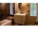 Beautiful bathroom features a modern vanity and textured tile walls at 101 S Maywood Ave, Clearwater, FL 33765