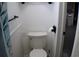 Cozy bathroom featuring a toilet, white walls, and essential fixtures at 101 S Maywood Ave, Clearwater, FL 33765