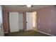 Bedroom featuring floral wallpaper border and closet at 101 S Maywood Ave, Clearwater, FL 33765