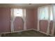 Bedroom featuring floral wallpaper border and natural light at 101 S Maywood Ave, Clearwater, FL 33765