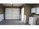 Clean and organized garage features a wash sink, painted walls, and ample storage space at 101 S Maywood Ave, Clearwater, FL 33765