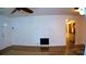 Bright living room with wood floors, front door, and access to kitchen at 101 S Maywood Ave, Clearwater, FL 33765