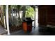 Outdoor cooking area features a built in Coca-Cola branded grill and mature tropical landscaping at 101 S Maywood Ave, Clearwater, FL 33765