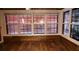 Enclosed sunroom features many windows with wood accent molding at 101 S Maywood Ave, Clearwater, FL 33765