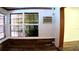 Corner sunroom with wood floors and access to the outdoors at 101 S Maywood Ave, Clearwater, FL 33765