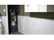 Utility area shows water heater, drywall, and hookups for an appliance. Clean and simple at 101 S Maywood Ave, Clearwater, FL 33765