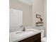Tastefully decorated bathroom with modern vanity and decorative wall art at 10379 Bridgegate Heights Loop, San Antonio, FL 33576