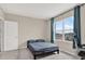 A cozy bedroom is bathed in natural light, with a simple bed and window view at 10379 Bridgegate Heights Loop, San Antonio, FL 33576