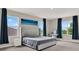 Bright bedroom with large windows and stylish decor creates a relaxing retreat at 10379 Bridgegate Heights Loop, San Antonio, FL 33576