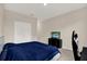 Bedroom featuring plush carpet, and a flat screen television on a dresser at 10379 Bridgegate Heights Loop, San Antonio, FL 33576