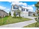 Charming two-story home featuring a three-car garage and manicured landscaping at 10379 Bridgegate Heights Loop, San Antonio, FL 33576