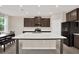 Modern kitchen featuring a large island with stainless steel appliances at 10379 Bridgegate Heights Loop, San Antonio, FL 33576