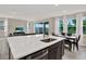 Spacious kitchen with quartz countertops, large island, and stainless steel dishwasher at 10379 Bridgegate Heights Loop, San Antonio, FL 33576