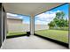Screened lanai offering views of the white fenced backyard at 10379 Bridgegate Heights Loop, San Antonio, FL 33576