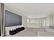 Spacious living room with a large movie screen, perfect for entertainment at 10379 Bridgegate Heights Loop, San Antonio, FL 33576