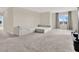 Spacious living room with a large sectional sofa and ample natural light at 10379 Bridgegate Heights Loop, San Antonio, FL 33576
