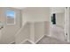 Stairway with plush carpeting leading to the next level of the home at 10379 Bridgegate Heights Loop, San Antonio, FL 33576