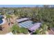 Aerial view of the community shuffleboard amenities with palm trees and natural settings at 10520 Tapestry Dr, Port Richey, FL 34668