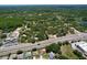 Expansive aerial view highlights the property's proximity to green spaces and a main road at 10520 Tapestry Dr, Port Richey, FL 34668