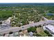 Overhead shot showing nearby highway access and surrounding wooded areas near the property at 10520 Tapestry Dr, Port Richey, FL 34668