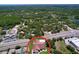 Aerial view of a home nestled in a neighborhood with mature trees and convenient access to nearby amenities at 10520 Tapestry Dr, Port Richey, FL 34668