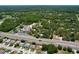 Wide aerial view captures the property's location near a major highway and commercial area at 10520 Tapestry Dr, Port Richey, FL 34668