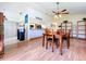 Open dining area with wood table, chairs, and view into the kitchen with breakfast bar at 10520 Tapestry Dr, Port Richey, FL 34668