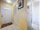 Welcoming foyer with tile flooring, closet, and view to the front door and adjacent hallway at 10520 Tapestry Dr, Port Richey, FL 34668