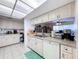 Bright kitchen with stainless steel appliances, white cabinetry, and modern fixtures at 10520 Tapestry Dr, Port Richey, FL 34668