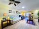 Bright living room with natural light, ceiling fan, and comfortable furniture at 10520 Tapestry Dr, Port Richey, FL 34668