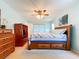 Inviting primary bedroom with ample natural light, comfortable bed, and classic decor at 10520 Tapestry Dr, Port Richey, FL 34668