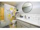Bathroom with marble countertop, gray cabinets, and modern fixtures at 11200 102Nd Ave # 62, Seminole, FL 33778