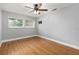 Comfortable bedroom with a ceiling fan, window, and laminate flooring for easy maintenance at 11200 102Nd Ave # 62, Seminole, FL 33778