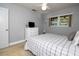 Bedroom with a window and ceiling fan at 11200 102Nd Ave # 62, Seminole, FL 33778