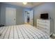 Bright bedroom featuring a ceiling fan, white dresser, and neutral walls at 11200 102Nd Ave # 62, Seminole, FL 33778