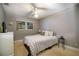 Bedroom featuring a ceiling fan, window, and light gray walls at 11200 102Nd Ave # 62, Seminole, FL 33778