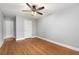 Well-lit bedroom with two doors, laminate floors, and light gray wall paint at 11200 102Nd Ave # 62, Seminole, FL 33778