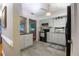 Bright kitchen with gray wood-look tile floors and modern appliances at 11200 102Nd Ave # 62, Seminole, FL 33778