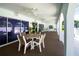 Covered patio with a ceiling fan and outdoor furniture for relaxation and entertaining at 11200 102Nd Ave # 62, Seminole, FL 33778