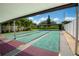 Outdoor shuffleboard courts with shaded seating and lush landscaping at 11200 102Nd Ave # 62, Seminole, FL 33778